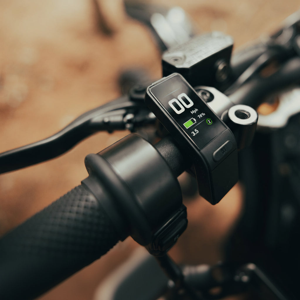 Close-up of an electric Dirt motorcycle handlebar with a digital display