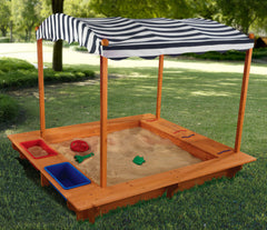 Wooden sandbox with a striped canopy on a grassy Play Area